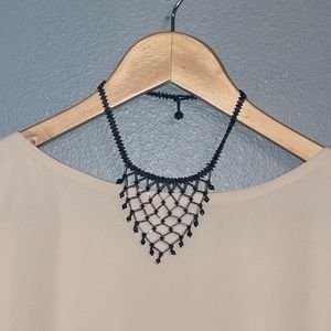 V-Neck hand beaded choker. Simple, but cute (and sexy!) must have jewelry piece